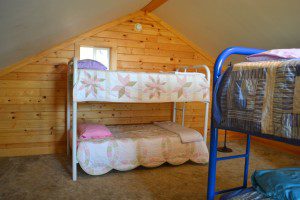 Two bunk beds in the upstairs bedroom